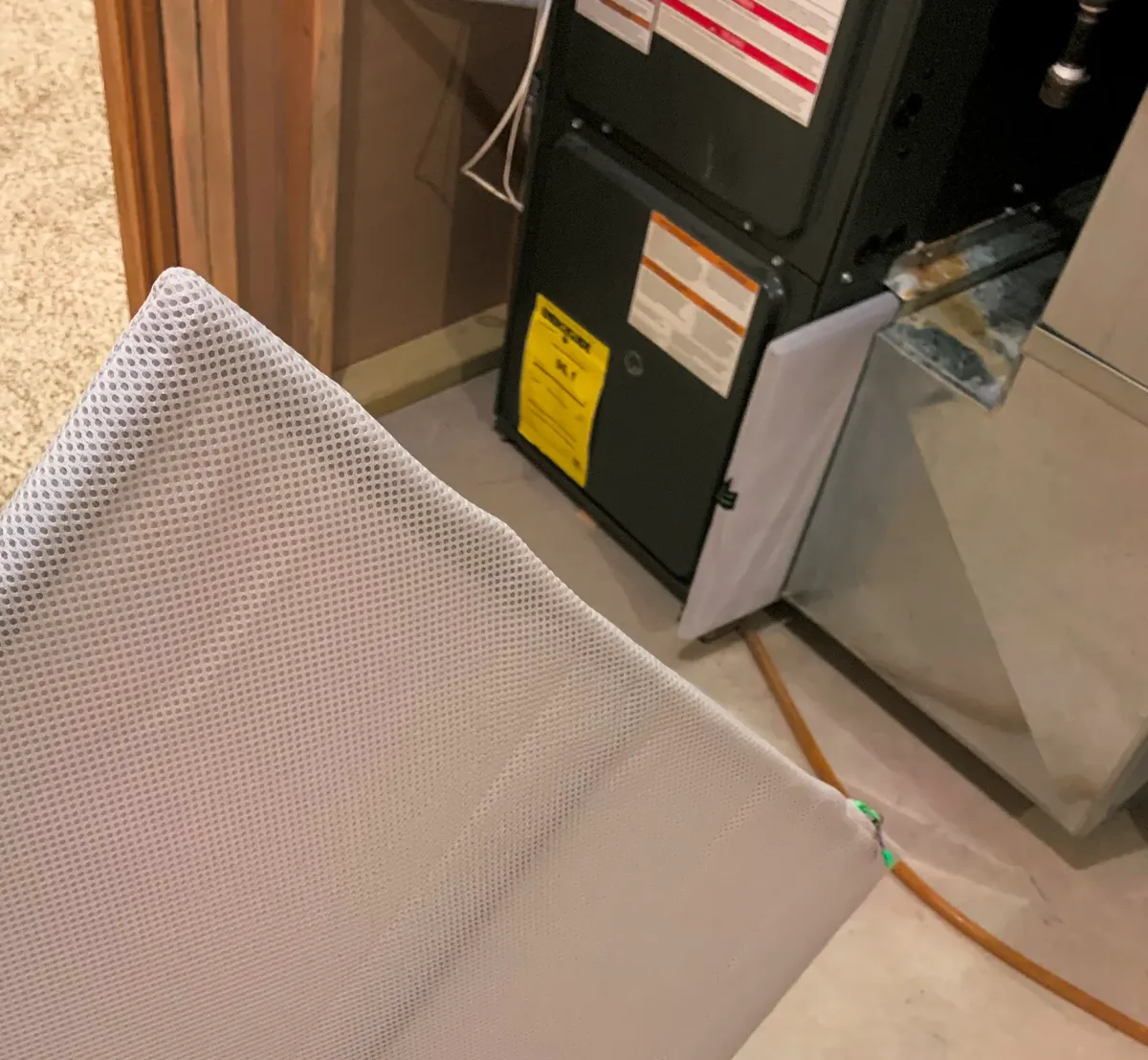 Removable air filter in front of a furnace cabinet and ductwork